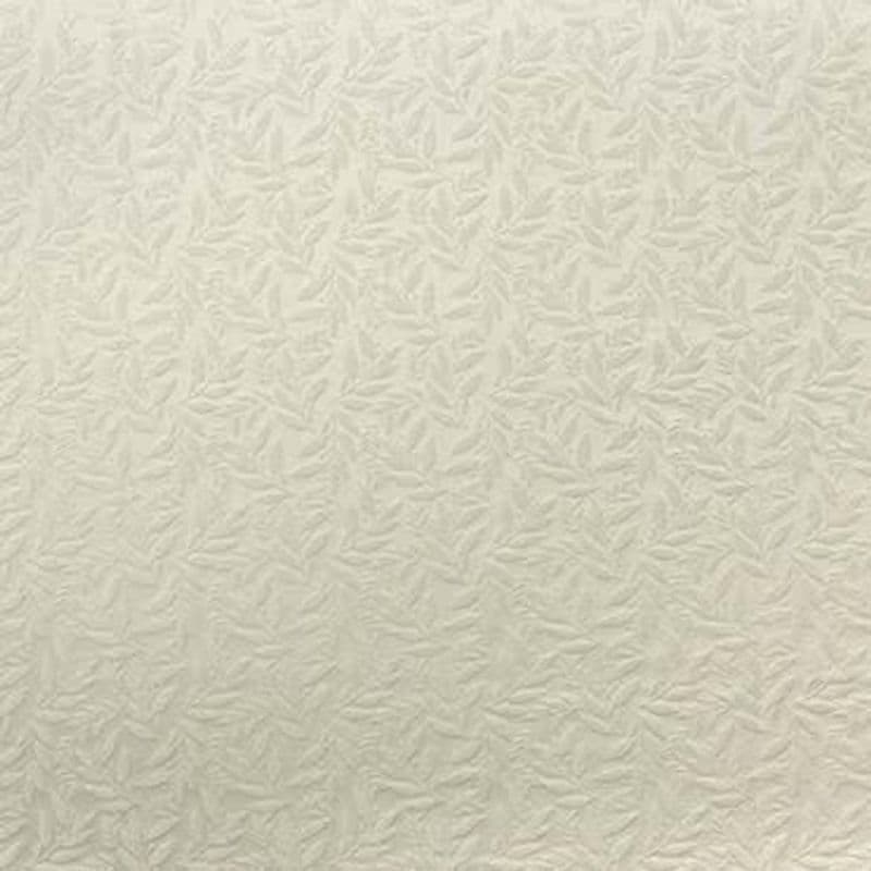 Embossed cream wallpaper with a repeating small leaf-like raised pattern covers a wall, casting subtle shadows in a softly lit, neutral-toned interior.