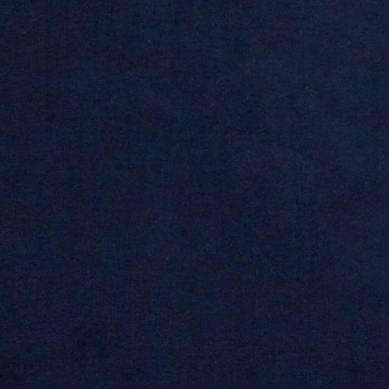 Navy-blue fabric panel fills the entire frame, appearing stretched and smooth; it uniformly absorbs light, creating a dim, evenly lit background with subtle textile texture and no visible features.