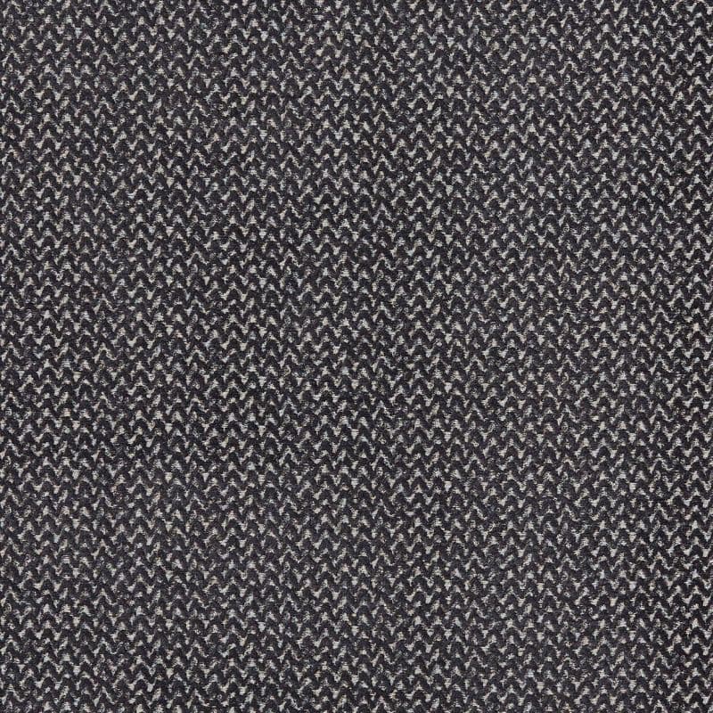 A woven textile with tight black-and-white herringbone zigzag pattern, displayed flat, showing textured knit and subtle sheen under even, neutral lighting in a close-up view.