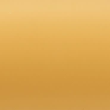 Plain ochre-gold painted wall—smooth, slightly textured—filling the frame; evenly lit with a soft top-to-bottom gradient; close-up, minimal composition without discernible objects or shadows.