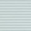 Horizontal pleated cellular shades fill the frame, evenly closed with thin horizontal bands; they diffuse soft, cool light, covering a window in a neutral, softly lit interior.
