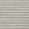 Light-gray textured pleated cellular shades, fully closed across the frame, blocking view and softly diffusing light; neutral interior setting with even, muted lighting and no visible furnishings.