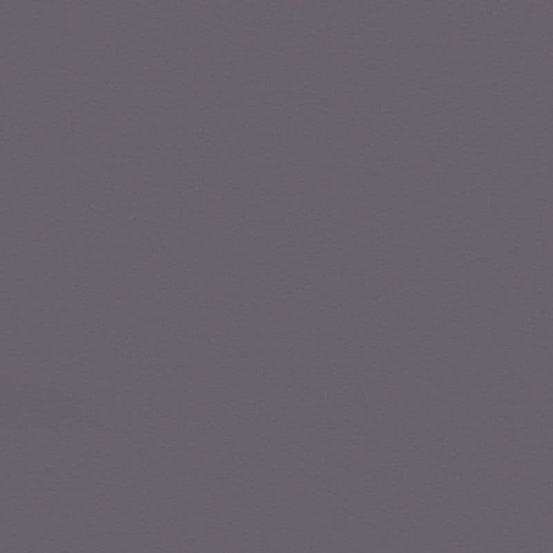 Solid matte gray textured wall filling the frame, uniformly lit and stationary, suggesting an interior surface with soft even lighting and no visible fixtures, furniture, or view.