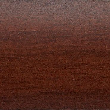 Dark reddish-brown wood surface (veneer) occupying the frame, showing fine horizontal grain and subtle sheen; flat tabletop under warm, diffuse lighting.