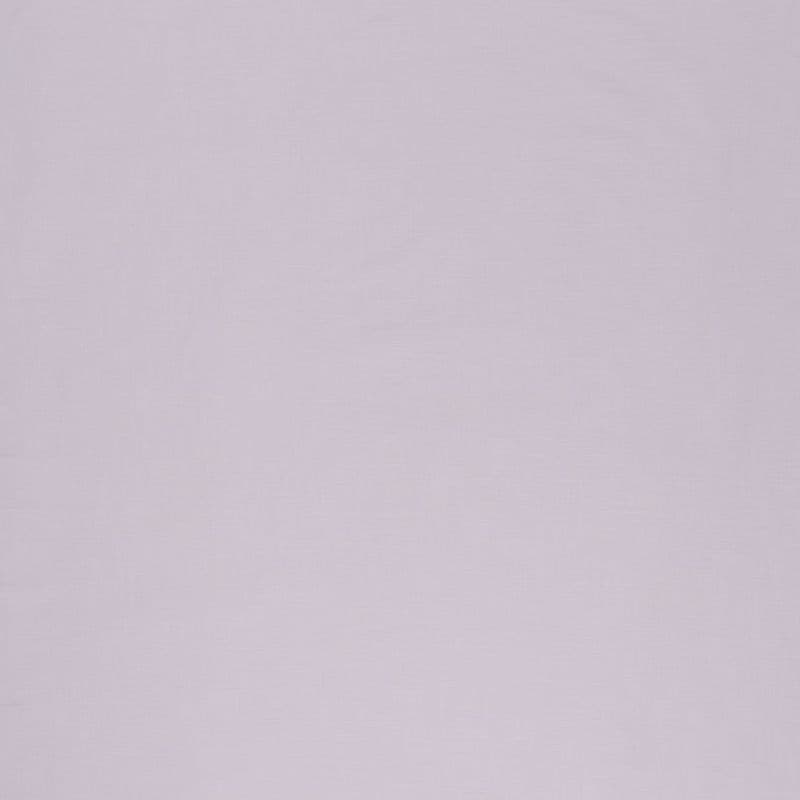 Solid pale lavender textile panel (curtain or wall covering) filling the frame, hanging flat and static with a subtle woven texture; evenly diffused indoor light, no other visible features.