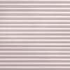 Pleated fabric blinds, horizontal pleated folds, fully closed, gently diffusing soft daylight; mounted over a window in a neutral-toned interior, creating uniform, muted light and textured pattern.