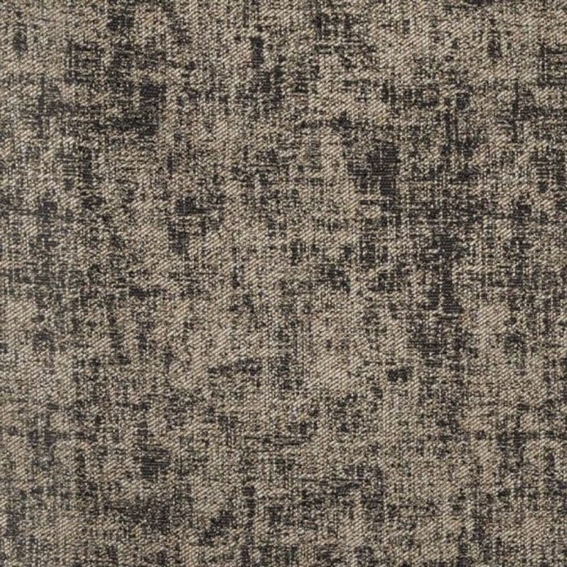 Woven gray-beige upholstery fabric close-up showing irregular black crosshatch and speckled pattern, revealing a coarse diagonal twill weave texture across a flat, evenly lit surface.