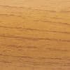 Wooden veneer panel with fine horizontal grain; smooth, warm honey finish displaying darker streaks; close-up of a tabletop or wall panel bathed in soft, warm indoor light.