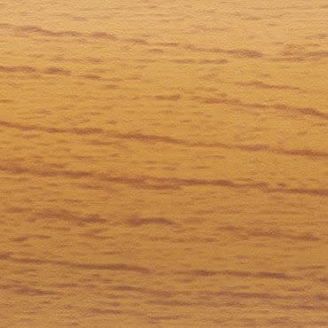 Wooden veneer panel with fine horizontal grain; smooth, warm honey finish displaying darker streaks; close-up of a tabletop or wall panel bathed in soft, warm indoor light.
