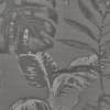 Large tropical leaves overlap, forming a repeating botanical pattern on textured gray woven fabric.