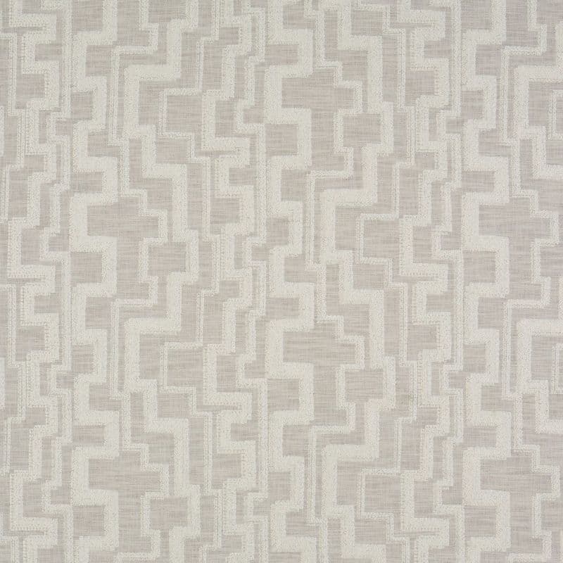 Textured geometric wallpaper: interlocking stepped rectangles in beige and cream, repeating across a fabric-like surface. Pattern lies flat, creating subtle raised contrast in soft, evenly lit, neutral interior context.