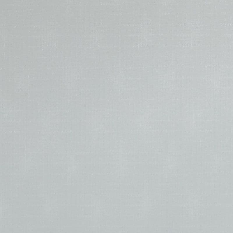 Light-gray fabric panel, fully drawn, smooth with subtle woven texture; blocking view and softly diffusing daylight in an evenly lit interior.