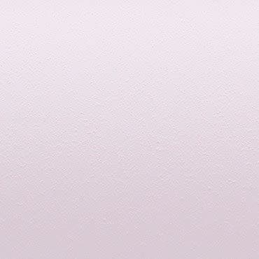 Pale pink, lightly stippled wall surface displaying a subtle textured finish; uniformly lit and filling the frame, with no visible fixtures or furniture, suggesting a neutral, minimal interior background.