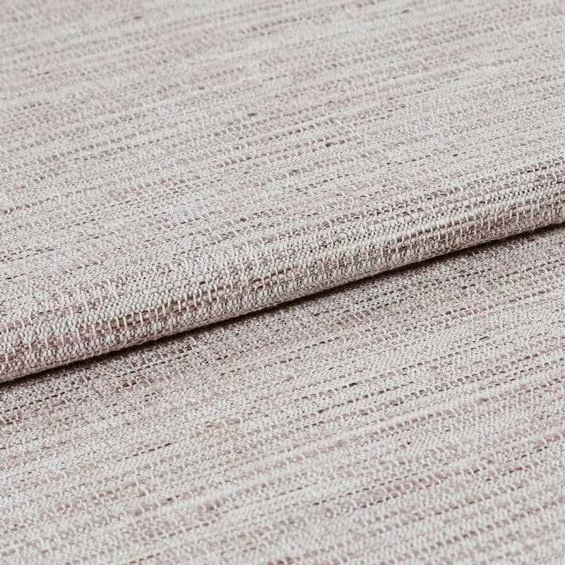 Beige-pink woven fabric with a coarse, looped texture, folded once and overlapping, shown in a close-up studio shot with soft, even lighting highlighting the weave.