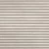 Beige pleated cellular shade, textured fabric with narrow horizontal folds, fully lowered and closed; filtering diffuse light into a neutral, softly lit interior space with no visible view.