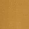 Plain mustard-yellow woven curtain hanging flat across the frame, closed; close-up of textured fabric in even indoor lighting, no visible window or furnishings.
