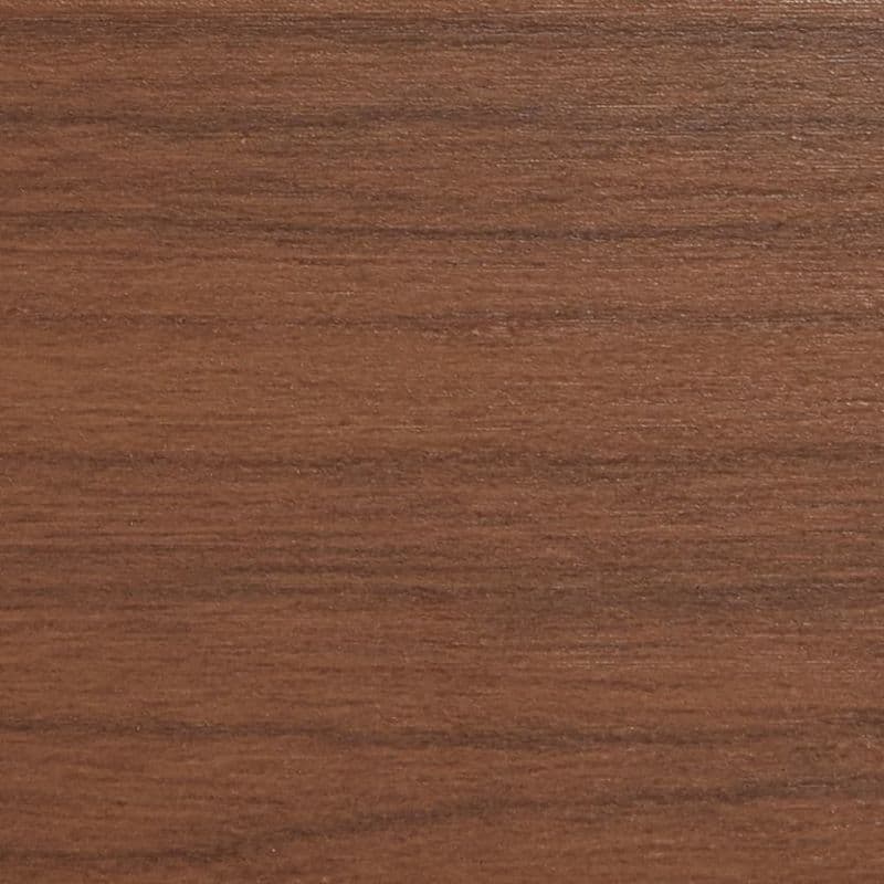 Horizontal walnut veneer panel filling the frame, displaying fine straight grain and subtle sheen; resting flat as a tabletop or shelf surface in soft, even indoor lighting.