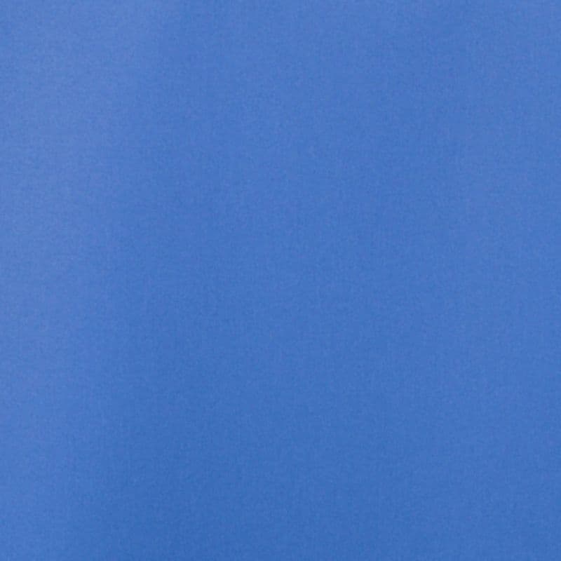 Solid blue panel fills the frame, showing slight vertical gradient and subtle grain; evenly lit, smooth surface with no other visible objects or context.