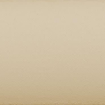 Textured beige plaster wall fills the frame, showing fine granular surface and a faint horizontal border at the bottom; uniformly lit, neutral close-up with soft, diffuse interior lighting.