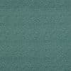 Teal fabric or wallpaper covered edge-to-edge with dense, irregular small white dots; repeating speckled pattern across a flat, evenly lit close-up surface suggesting textile or wall covering.