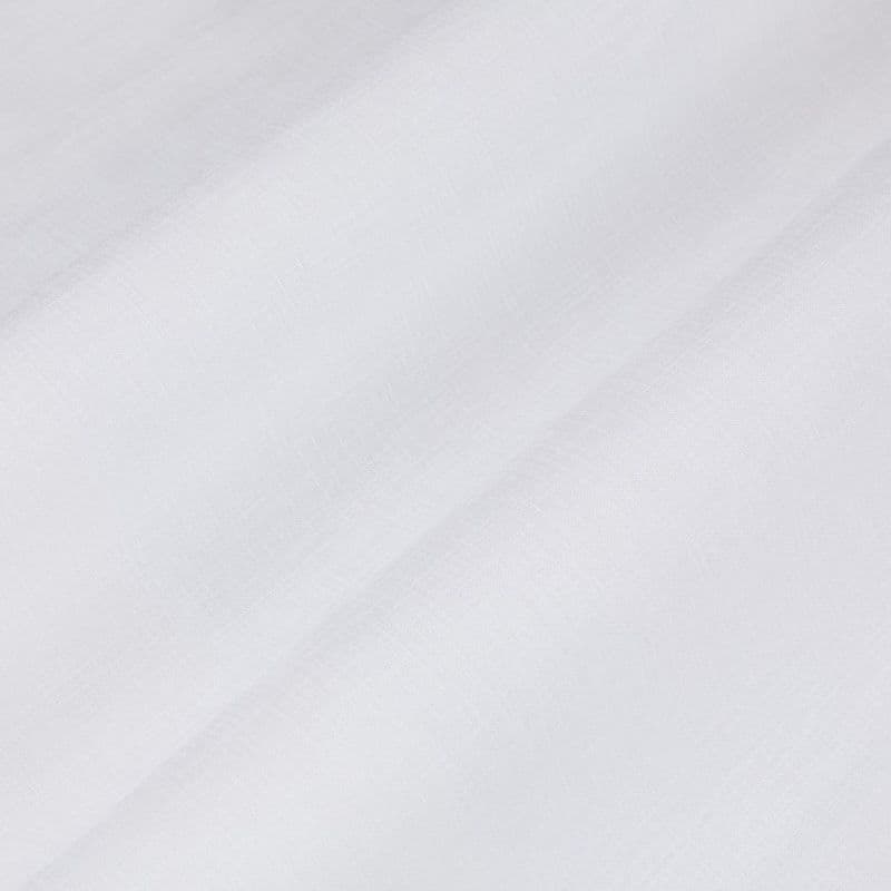 Sheer white curtain panel with fine woven texture, draping in soft diagonal folds, gently filtering diffuse light against a bright, neutral interior—close-up view.