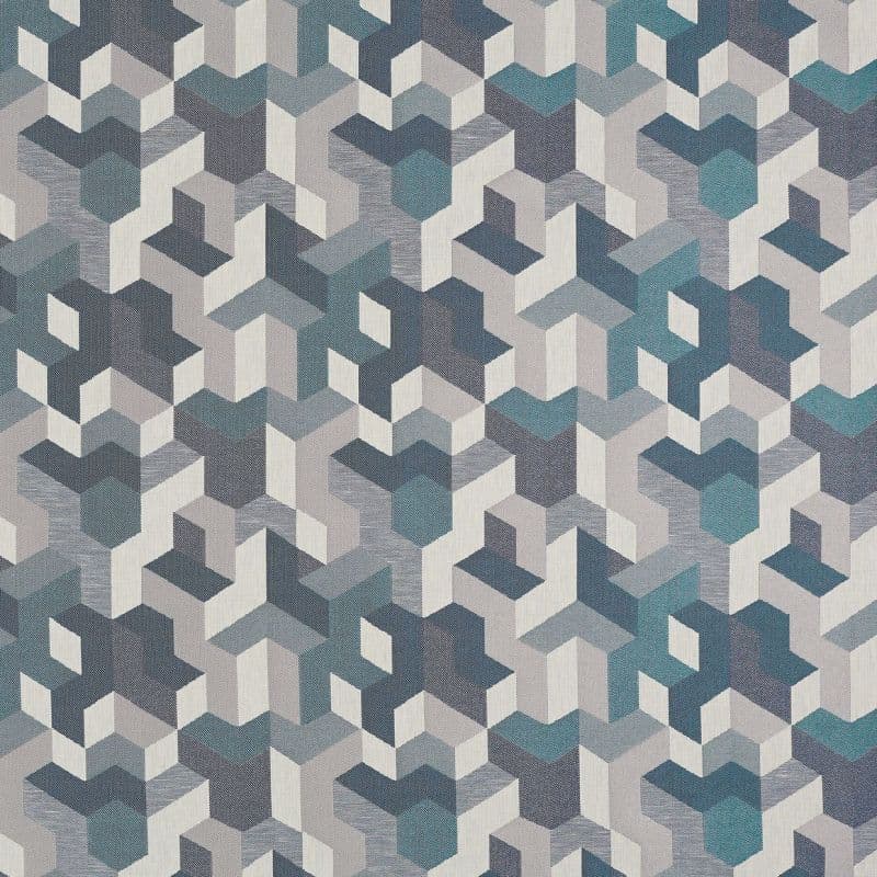 Geometric woven textile with repeating isometric cube shapes in teal, gray, navy and cream, forming an optical depth pattern across a flat decorative surface under neutral light.