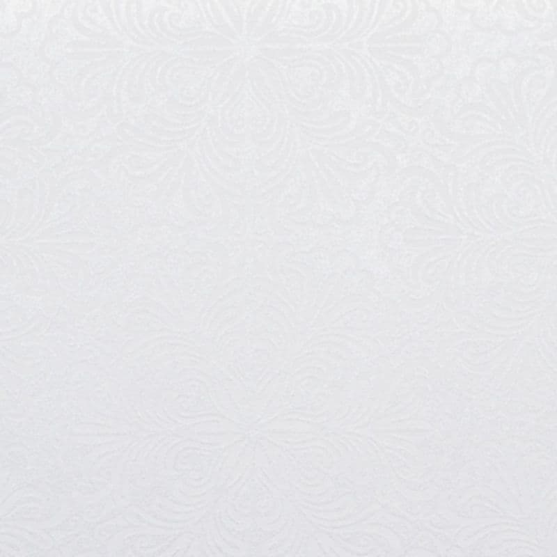 Embossed white wallpaper—subtle floral and swirl pattern—covers a wall surface, providing a uniform, matte texture; evenly lit interior context with soft, diffused lighting and neutral tones.
