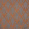 Grey wallcovering with bold orange geometric lattice of intersecting angular lines, forming repeating diamond shapes across a flat, evenly lit close-up surface.