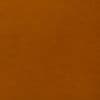 Orange-brown textured surface filling the frame — static and unbroken — evenly lit with slight graininess — close-up interior view with no discernible features or objects.
