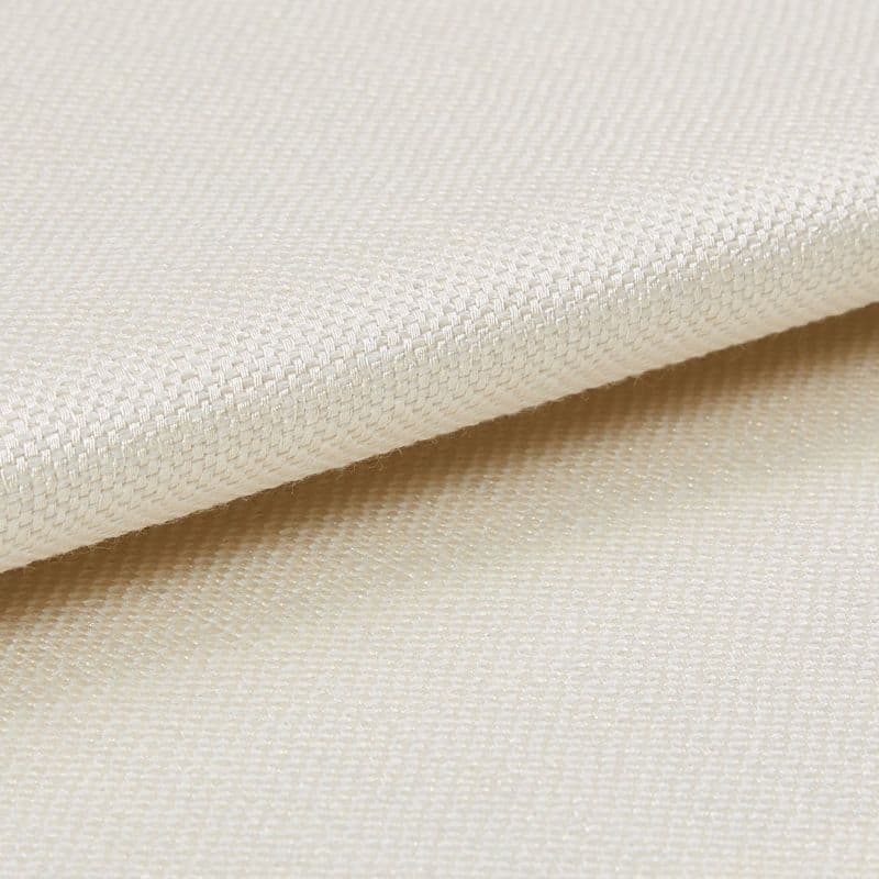 Woven cream fabric folded over itself, revealing a tight basket weave; close-up, evenly lit studio view with neutral background highlighting the texture.