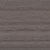 Gray-brown textured surface (appears like fabric or wood grain) displaying subtle horizontal striations; close-up, evenly lit, filling the frame with muted, neutral tones.