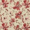 Beige fabric with large sketchy red and pink floral motifs — repeating all-over pattern across the surface — flat-lit close-up showing textured, embroidered-like detail.