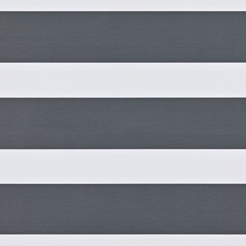 Dual-layer zebra roller blind with wide opaque white bands and narrower textured dark-gray sheer stripes, mounted across a window; aligned to create alternating bands, partially filtering daylight in an interior.